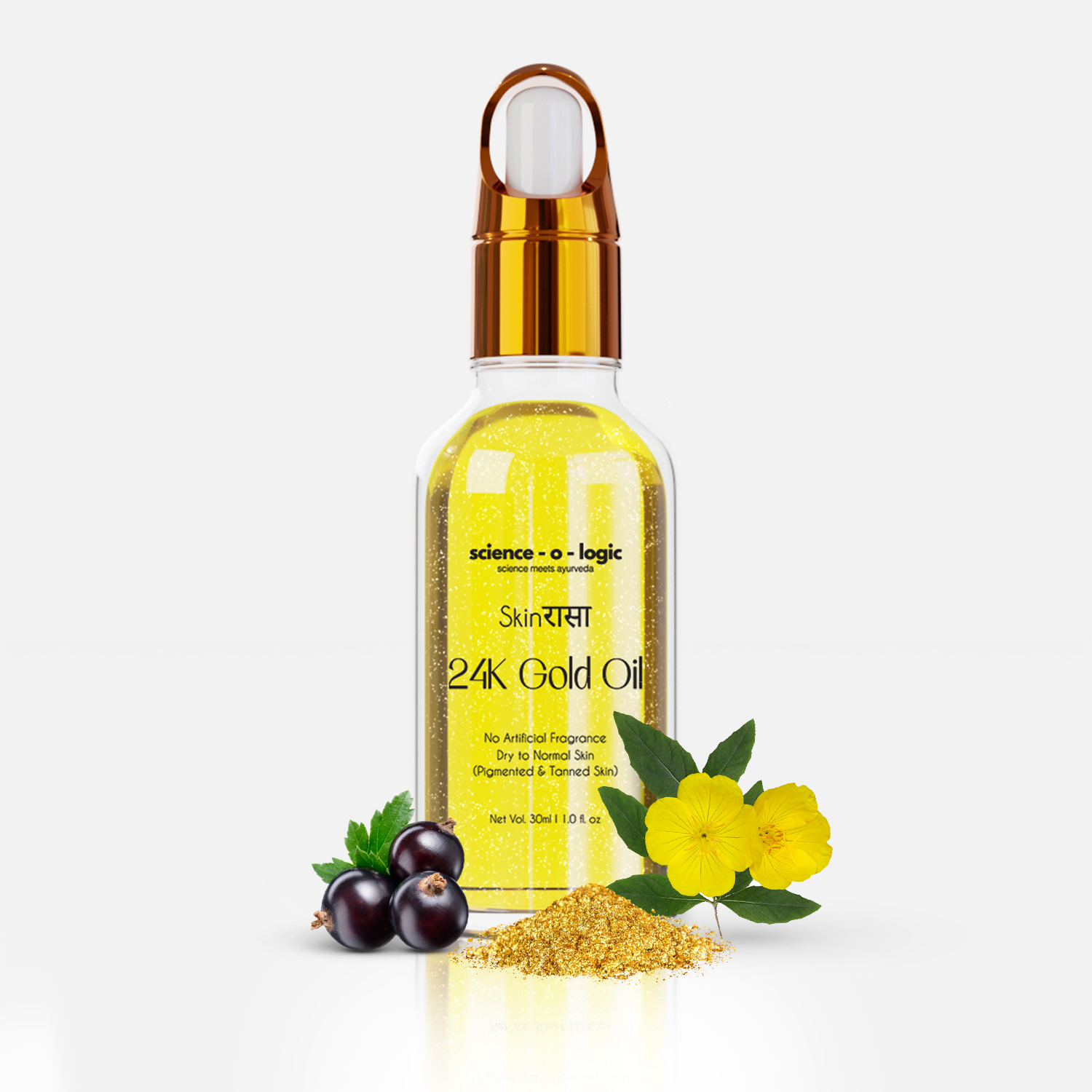 Botanical evidence — gold flake, blackcurrant and evening primrose beside the 24K Gold Oil bottle