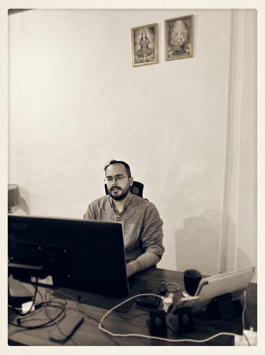 Portrait VI — Arjoon Mehra at work in the apothecary, present day